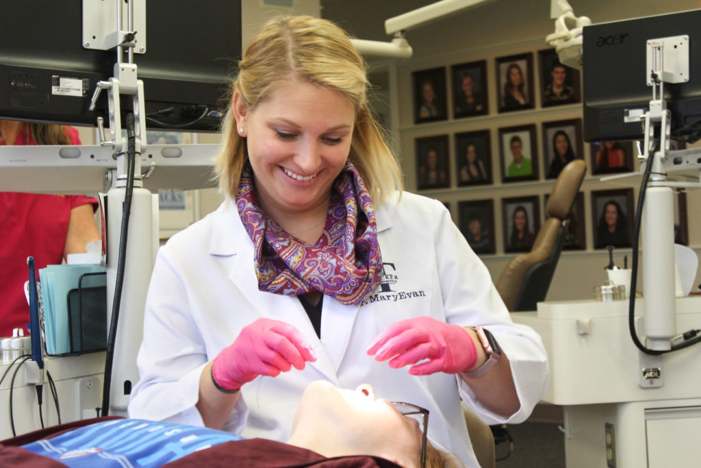 Your Hillsboro Orthodontist Dr. MaryEvan working with a patient