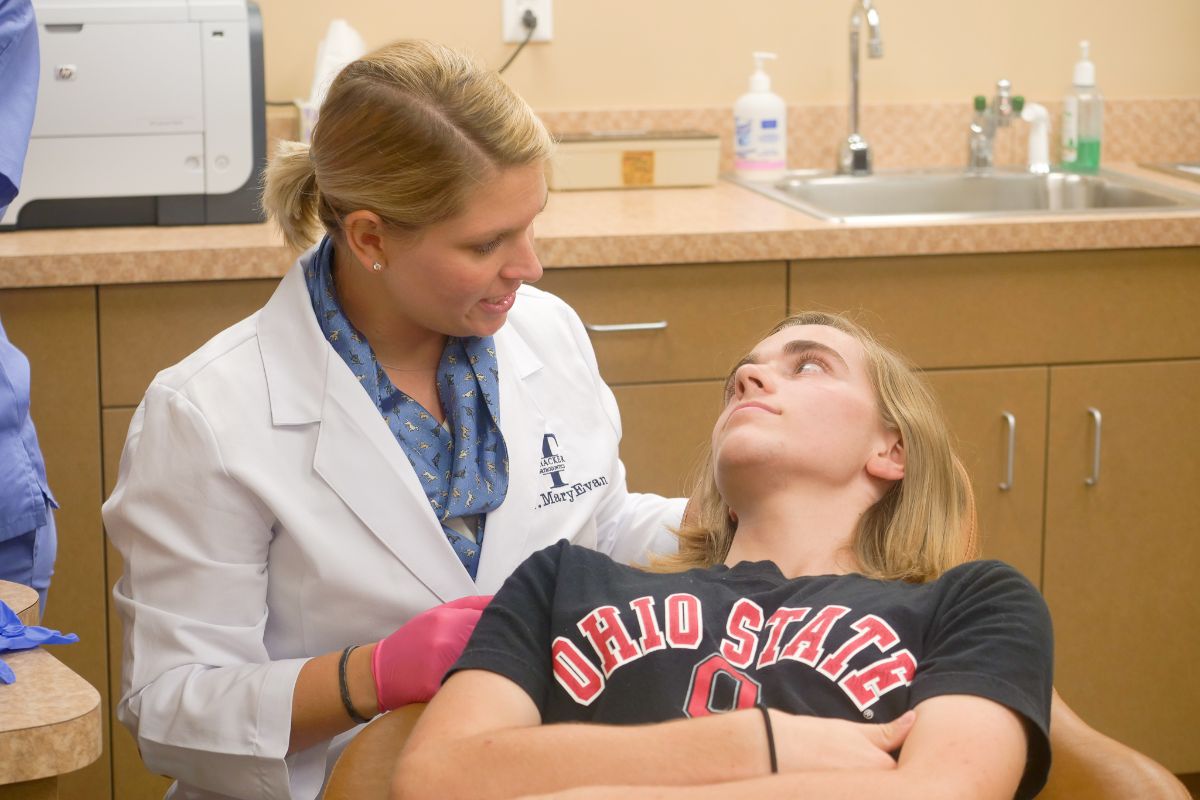 Dr. MaryEvan talking to a teen patient