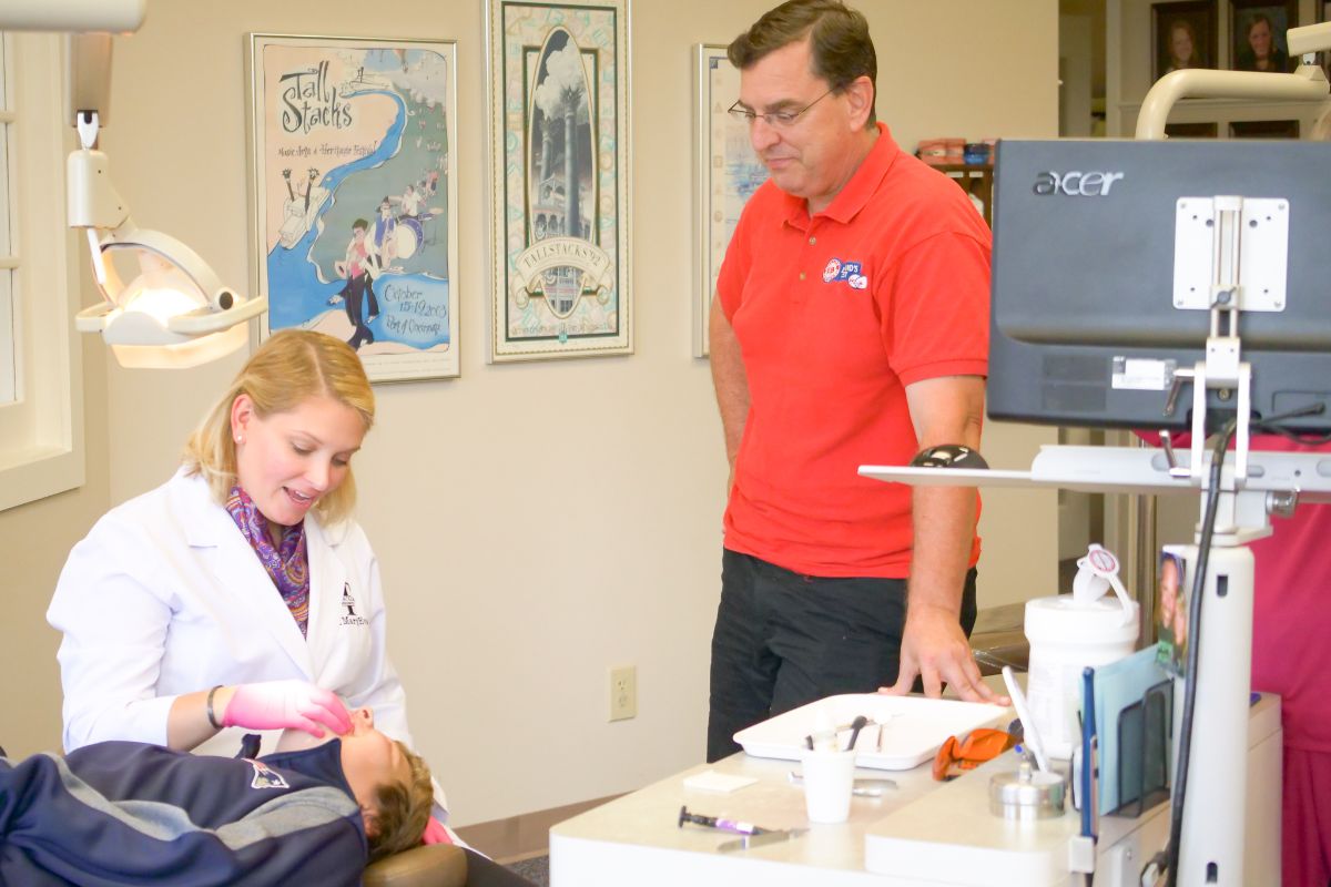 Dr. MaryEvan talking to a patient's parent