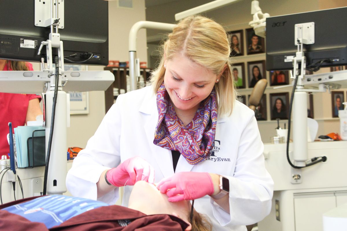Dr. MaryEvan working on a patient's teeth