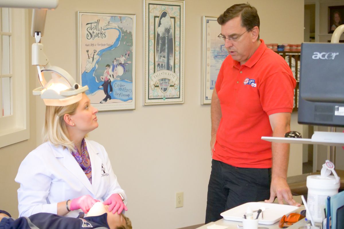 Dr. MaryEvan talking to a patient's dad
